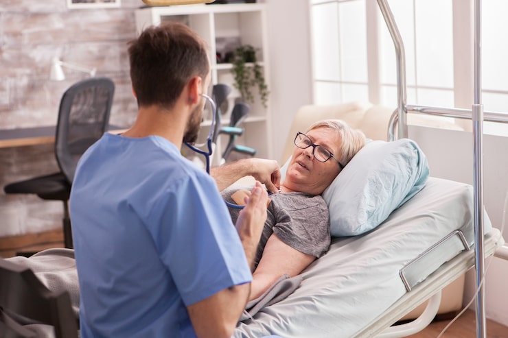 http://back-view-male-doctor-using-stethoscope-check-woman-heart-nursing-home_482257-22869