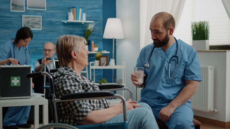 http://nurse-preparing-effervescent-pill-water-glass-patient-nursing-home-medical-assistant-giving-vitamin-drink-old-disabled-woman-wheelchair-healthcare-treatment_482257-42632