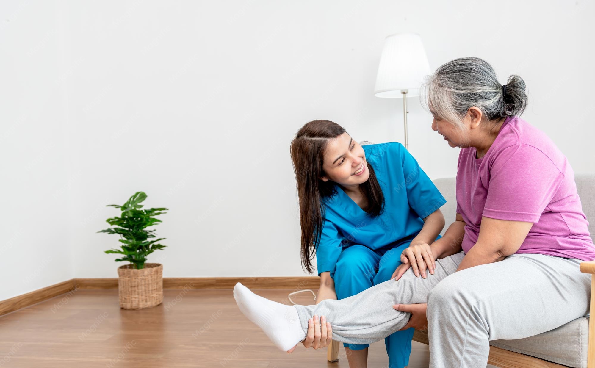physical-therapist-asian-woman-doing-leg-physiotherapy-elderly-woman-treat-osteoarthritis-nerve-pain-leg-nursing-home-health-care-concept_34985-1216