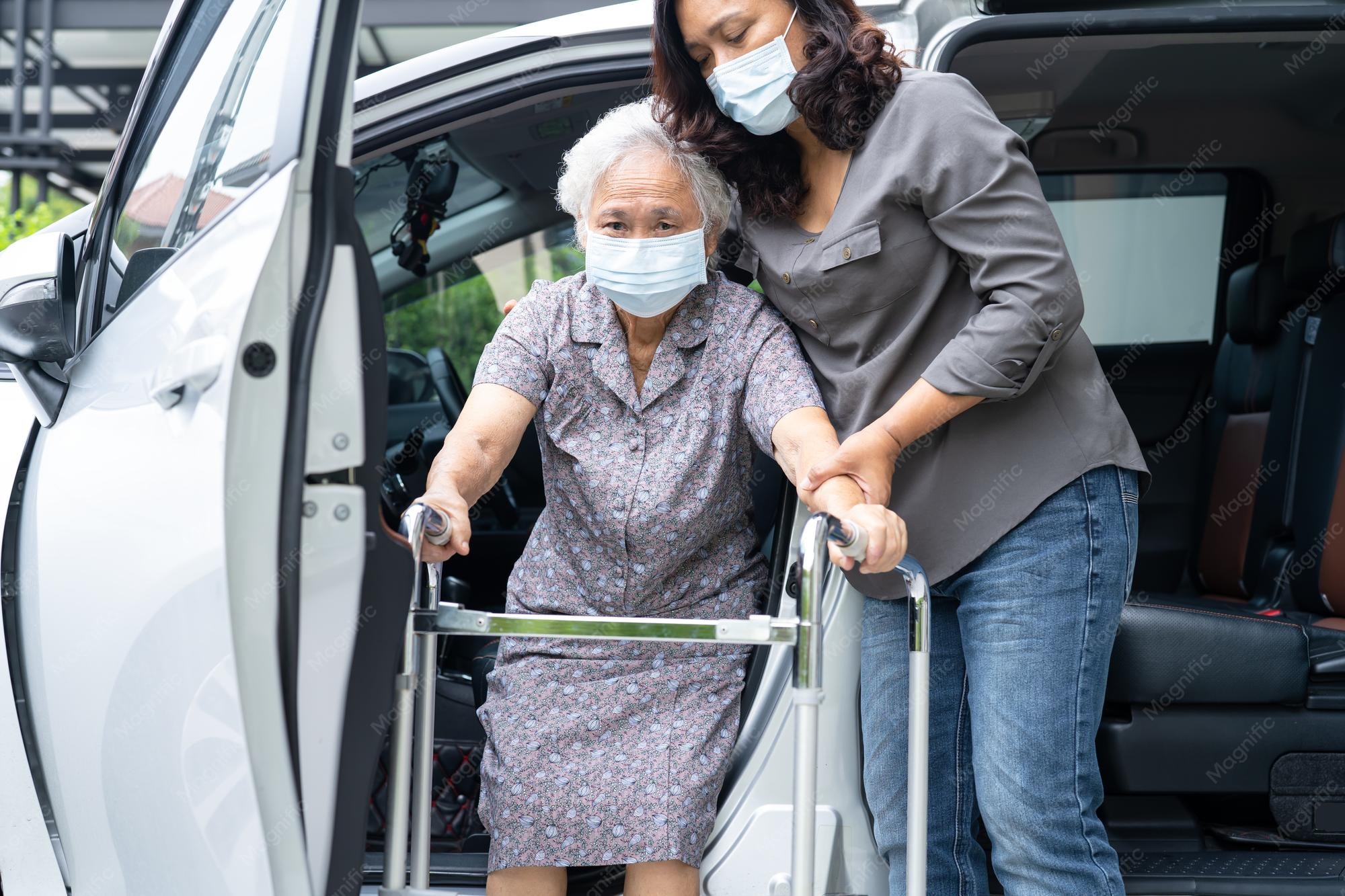 http://caregiver-help-support-asian-senior-woman-patient-walk-with-walker-prepare-get-her-car_39768-20727