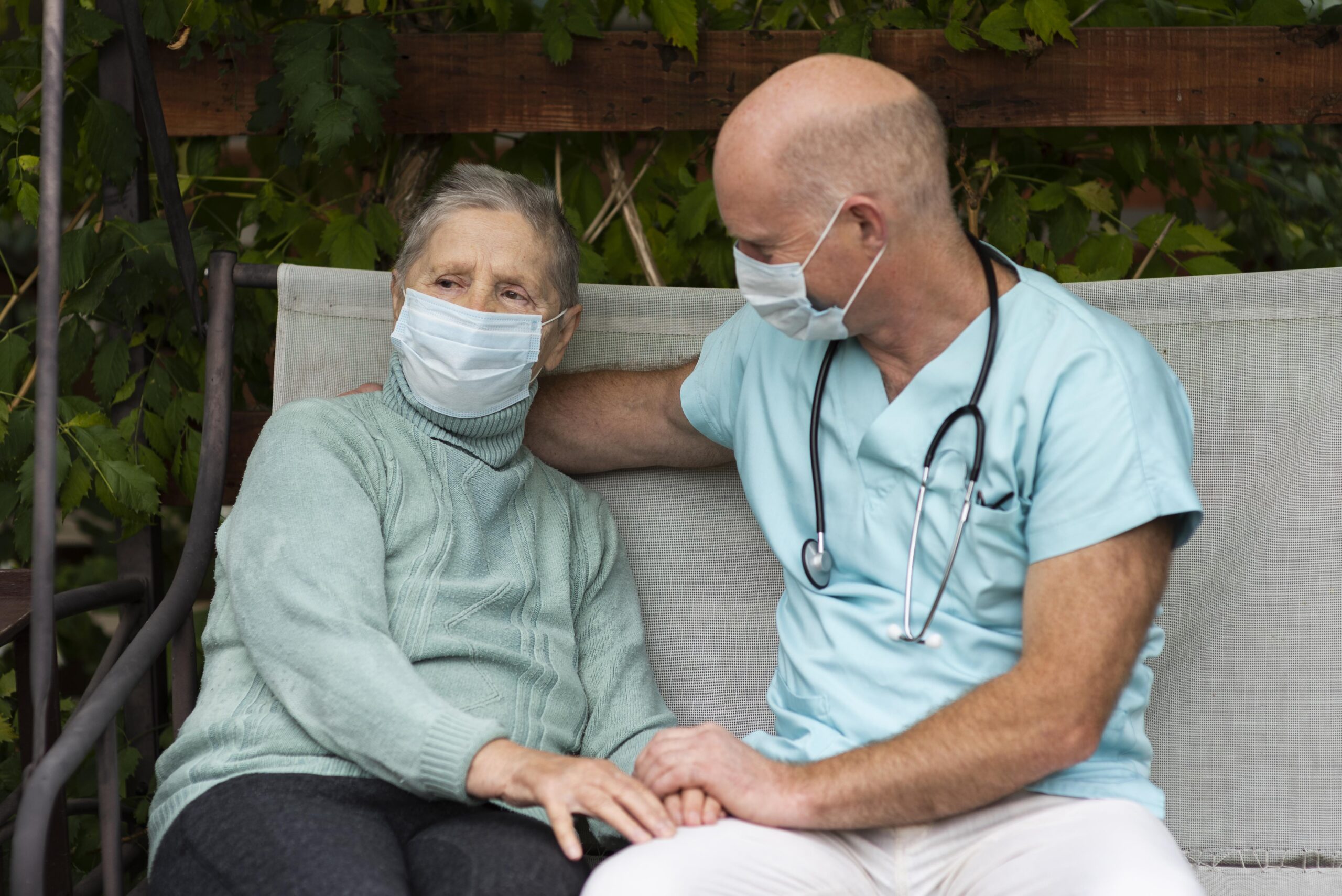 male-nurse-swing-chair-with-senior-woman